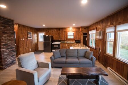 Open concept living area and kitchen in suite 25 - Ocean View Cottages & Campground